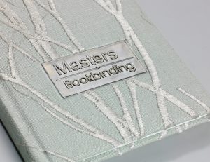 Material over board, case bound book