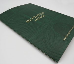 Soft cover property brochure singer sewn with gold thread